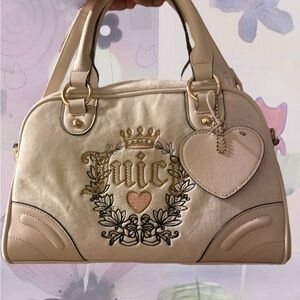 Juicy Couture Cream Satchel with Signature Crest and Metallic Hardware